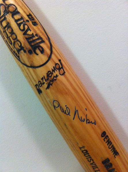 A cracked spring training bat signed by then pitching coach Phil Niekro.